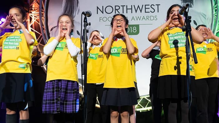 Singers cup hands around their mouths to 'spreading the word'